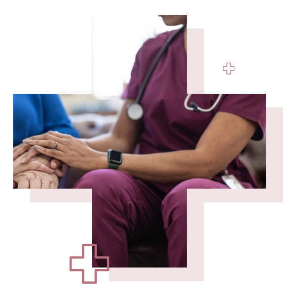 A healthcare professional holding a patient's hand
